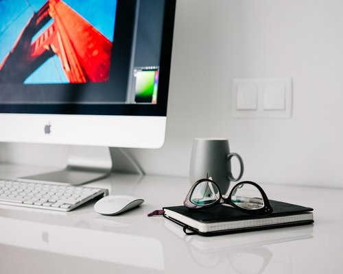 Office worker drinking water from a glass at desk